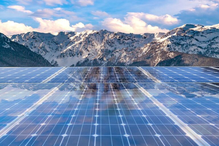 solar panels and snowy mountains